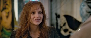 Movie still from “I Give It a Year” (2013), directed by Dan Mazer – A person with long red hair; Close Up shot, Over the shoulder angle