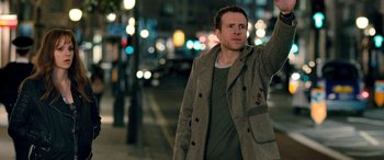 Movie still from “I Give It a Year” (2013), directed by Dan Mazer – A man is walking down the street at night; Medium shot, Low angle