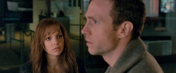 Movie still from “I Give It a Year” (2013), directed by Dan Mazer – A man and a woman looking at one another; Close Up shot, Over the shoulder angle