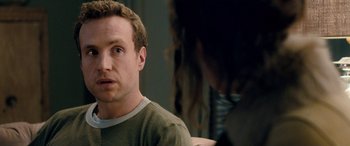 Movie still from “I Give It a Year” (2013), directed by Dan Mazer – A person sitting in front of another person; Close Up shot, Over the shoulder angle