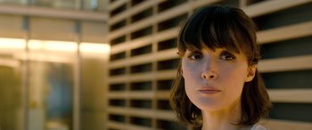 Movie still from “I Give It a Year” (2013), directed by Dan Mazer – A person wearing a dress; Close Up shot, Low angle