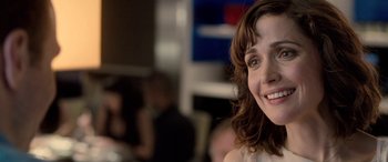 Movie still from “I Give It a Year” (2013), directed by Dan Mazer – A woman smiling for the camera; Close Up shot, Over the shoulder angle