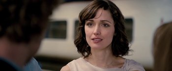 Movie still from “I Give It a Year” (2013), directed by Dan Mazer – A person wearing a white shirt; Close Up shot, Over the shoulder angle