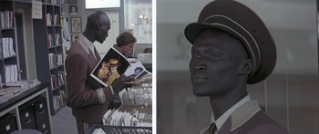 Movie still from “I Heart Huckabees” (2004), directed by David O. Russell – Two pictures of a man in a hat holding a book; Medium shot, Over the shoulder angle