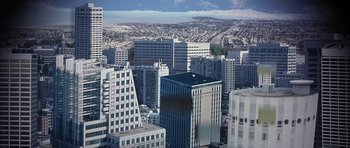 Movie still from “I Heart Huckabees” (2004), directed by David O. Russell – An aerial view of a large city with many tall buildings; Extreme Wide shot, High angle