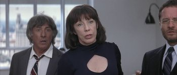 Movie still from “I Heart Huckabees” (2004), directed by David O. Russell – A person wearing a black shirt; Close Up shot, Over the shoulder angle