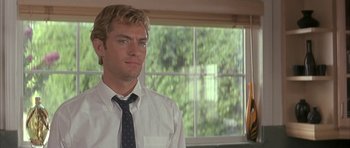 Movie still from “I Heart Huckabees” (2004), directed by David O. Russell – A man in a white dress shirt and a tie; Close Up shot, Low angle