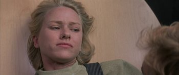 Movie still from “I Heart Huckabees” (2004), directed by David O. Russell – A woman laying on the ground with her eyes closed; Close Up shot, Low angle