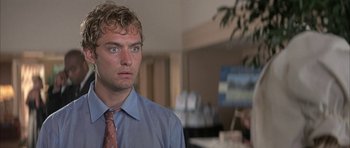 Movie still from “I Heart Huckabees” (2004), directed by David O. Russell – A person wearing a shirt and a tie; Close Up shot, Low angle