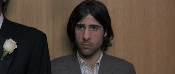 Movie still from “I Heart Huckabees” (2004), directed by David O. Russell – A person with long hair; Close Up shot, Over the shoulder angle