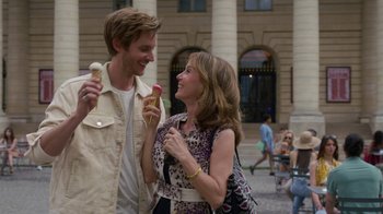 Movie still from “Emily in Paris” (2020), created by Darren Star – A man and a woman are eating ice cream; Medium shot, Over the shoulder angle