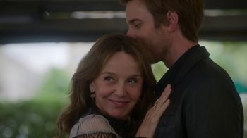 Movie still from “Emily in Paris” (2020), created by Darren Star – A man and a woman are posing for a picture; Close Up shot, Over the shoulder angle