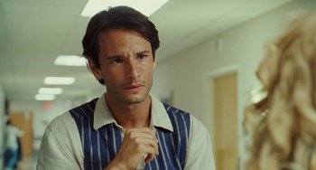 Movie still from “I Love You Phillip Morris” (2009), directed by John Requa – A person wearing a shirt and tie; Close Up shot, Over the shoulder angle
