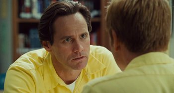 Movie still from “I Love You Phillip Morris” (2009), directed by John Requa – A man in a yellow shirt talking to another man in a yellow shirt; Close Up shot, Over the shoulder angle
