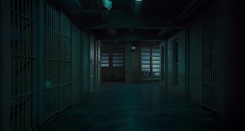 Movie still from “I Love You Phillip Morris” (2009), directed by John Requa – A dark room with a lot of windows and a door; Extreme Wide shot, High angle