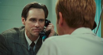 Movie still from “I Love You Phillip Morris” (2009), directed by John Requa – A man is talking on a phone in front of a mirror; Close Up shot, Over the shoulder angle