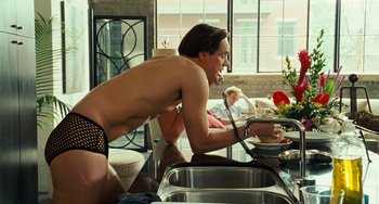 Movie still from “I Love You Phillip Morris” (2009), directed by John Requa – A man in underwear standing in front of a kitchen sink; Medium shot, Over the shoulder angle