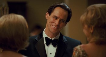Movie still from “I Love You Phillip Morris” (2009), directed by John Requa – A man in a tuxedo smiling for the camera; Close Up shot, Over the shoulder angle