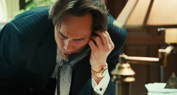 Movie still from “I Love You Phillip Morris” (2009), directed by John Requa – A person talking on a cell phone; Close Up shot, Low angle