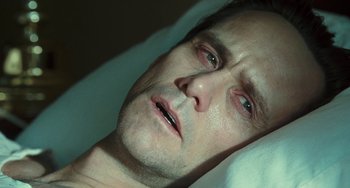 Movie still from “I Love You Phillip Morris” (2009), directed by John Requa – A person laying in a bed; Close Up shot, High angle