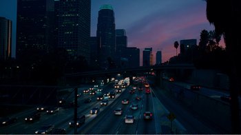 Movie still from “I Love You, Man” (2009), directed by John Hamburg – A view of a city at night with cars driving on the road; Extreme Wide shot, High angle