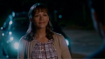 Movie still from “I Love You, Man” (2009), directed by John Hamburg – A woman standing in front of a car at night; Close Up shot, Over the shoulder angle