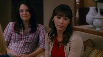 Movie still from “I Love You, Man” (2009), directed by John Hamburg – Two women sitting at a table in front of each other; Close Up shot, Over the shoulder angle