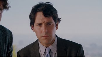 Movie still from “I Love You, Man” (2009), directed by John Hamburg – A person wearing a suit and tie; Close Up shot, Over the shoulder angle