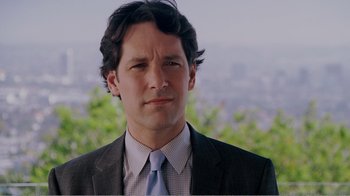 Movie still from “I Love You, Man” (2009), directed by John Hamburg – A person wearing a suit and tie; Close Up shot, Over the shoulder angle
