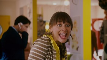 Movie still from “I Love You, Man” (2009), directed by John Hamburg – A woman with a yellow scarf and a striped shirt; Close Up shot, Overhead angle