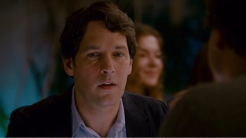 Movie still from “I Love You, Man” (2009), directed by John Hamburg – A person wearing a suit and tie; Close Up shot, Over the shoulder angle