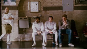 Movie still from “I Love You, Man” (2009), directed by John Hamburg – A group of men sitting on top of a bench; Wide shot, Low angle