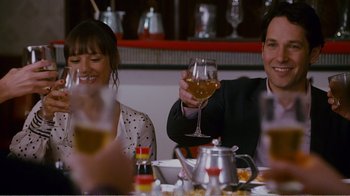 Movie still from “I Love You, Man” (2009), directed by John Hamburg – A man and a woman sitting at a table with a glass of wine; Medium shot, Over the shoulder angle