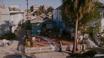 Movie still from “I Love You, Man” (2009), directed by John Hamburg – A man standing on a sidewalk next to a house; Extreme Wide shot, High angle
