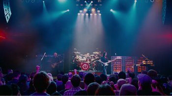 Movie still from “I Love You, Man” (2009), directed by John Hamburg – A band performing on a stage in front of an audience; Extreme Wide shot, High angle