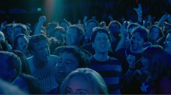 Movie still from “I Love You, Man” (2009), directed by John Hamburg – A group of people in a room watching a show; Medium shot, High angle