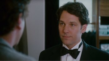 Movie still from “I Love You, Man” (2009), directed by John Hamburg – A man in a suit and bow tie looking to his left; Close Up shot, Over the shoulder angle