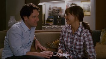 Movie still from “I Love You, Man” (2009), directed by John Hamburg – A man and a woman sitting on a couch talking to each other; Medium shot, Over the shoulder angle