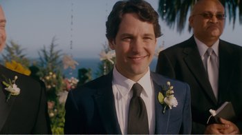 Movie still from “I Love You, Man” (2009), directed by John Hamburg – A man in a suit and tie smiling for a picture; Close Up shot, Over the shoulder angle
