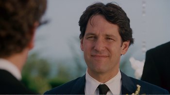 Movie still from “I Love You, Man” (2009), directed by John Hamburg – A person wearing a suit and tie; Close Up shot, Over the shoulder angle