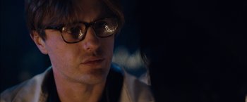 Movie still from “I Origins” (2014), directed by Mike Cahill – A person wearing glasses; Close Up shot, Over the shoulder angle