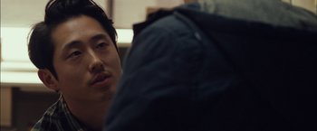 Movie still from “I Origins” (2014), directed by Mike Cahill – A person with a jacket on; Close Up shot, Over the shoulder angle