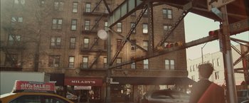 Movie still from “I Origins” (2014), directed by Mike Cahill – A building that has a lot of windows on it; Extreme Wide shot, Overhead angle