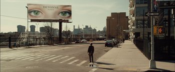 Movie still from “I Origins” (2014), directed by Mike Cahill – A man standing on the side of the street; Extreme Wide shot, Over the shoulder angle