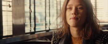 Movie still from “I Origins” (2014), directed by Mike Cahill – A person wearing a leather jacket; Close Up shot, Over the shoulder angle