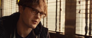 Movie still from “I Origins” (2014), directed by Mike Cahill – A person wearing glasses; Close Up shot, Over the shoulder angle