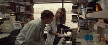 Movie still from “I Origins” (2014), directed by Mike Cahill – A man and a woman working in a lab; Medium shot, Over the shoulder angle
