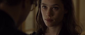 Movie still from “I Origins” (2014), directed by Mike Cahill – A person with long brown hair; Close Up shot, Over the shoulder angle