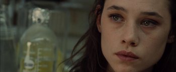 Movie still from “I Origins” (2014), directed by Mike Cahill – A woman's face with long brown hair; Close Up shot, Over the shoulder angle