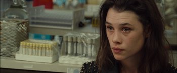 Movie still from “I Origins” (2014), directed by Mike Cahill – A person wearing a black jacket; Close Up shot, Over the shoulder angle